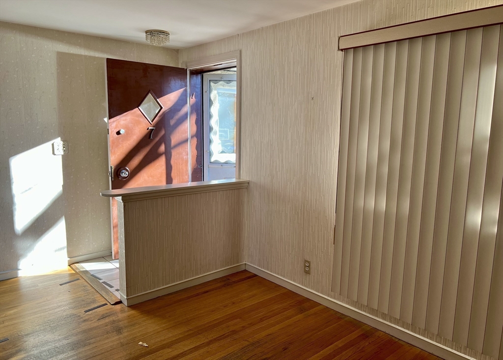 7 Ames Road Marblehead, MA 01945 - Photo 4 of 12 a view of an empty room with wooden floor