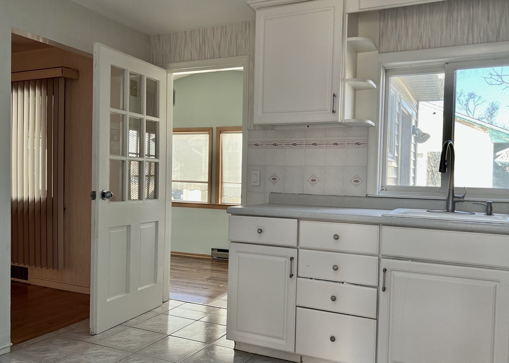 7 Ames Road Marblehead, MA 01945 - Photo 7 of 12 a view of cabinets a window and a dresser
