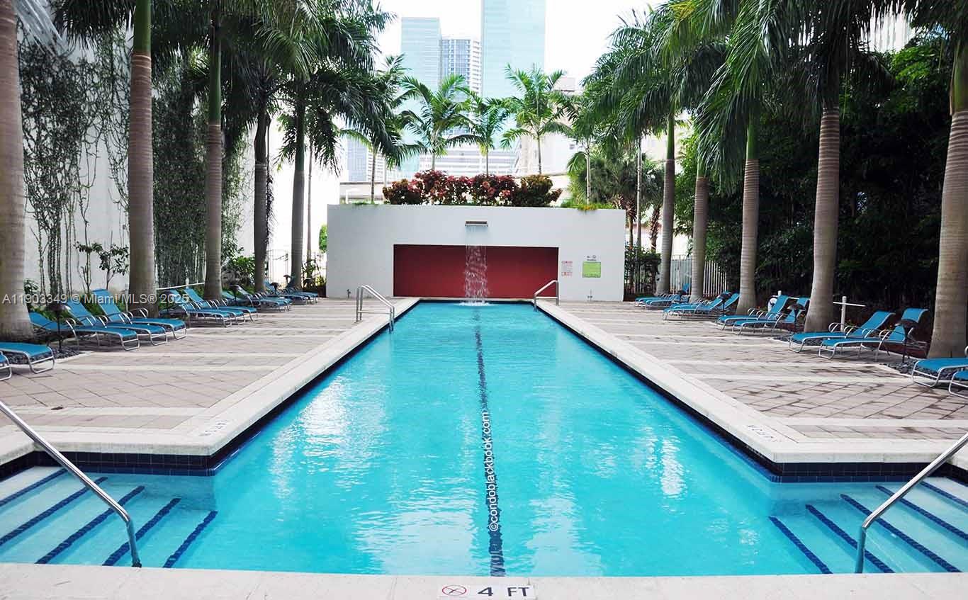 133 Northeast 2nd Avenue, Unit 2904 Miami, FL 33132 - Photo 11 of 11 a view of a backyard with a patio and a fire pit