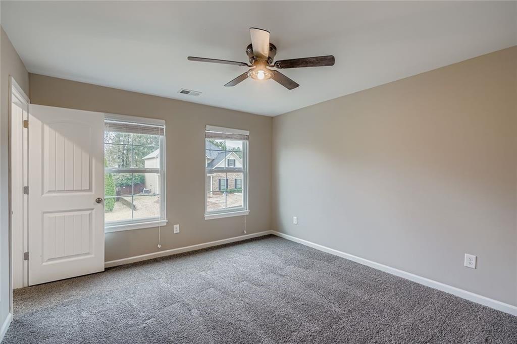 114 Greenbrier Way Canton, GA 30114 - Photo 18 of 32 a view of an empty room with a window