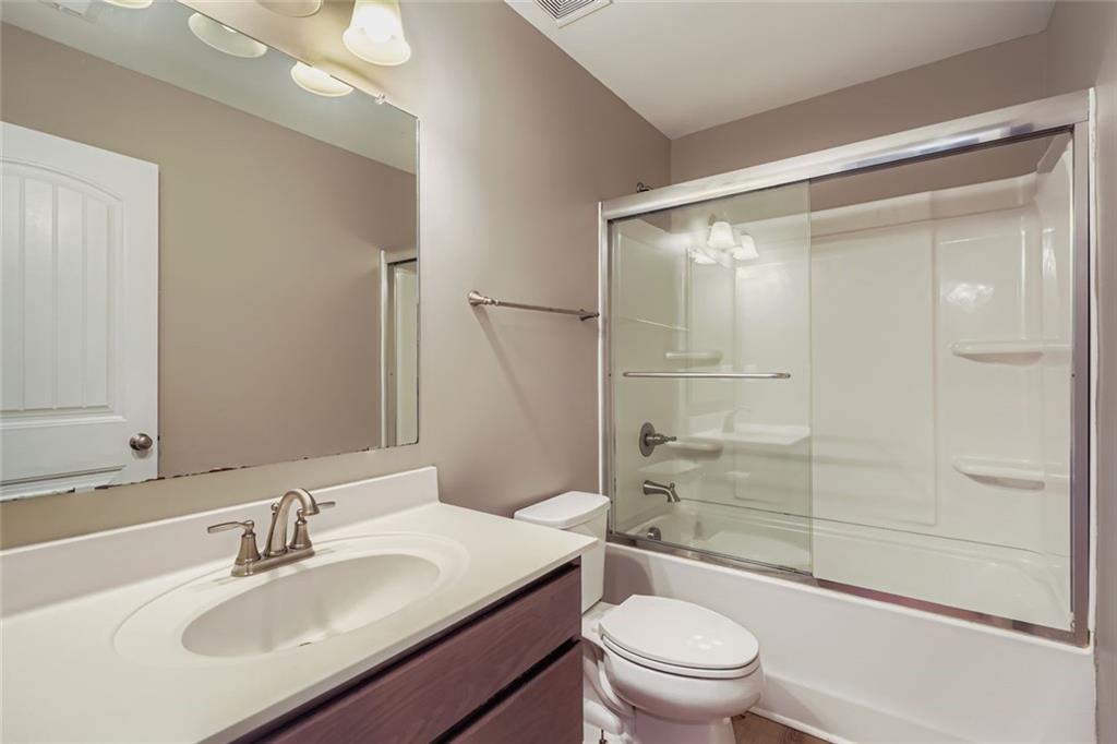 114 Greenbrier Way Canton, GA 30114 - Photo 19 of 32 a bathroom with a sink a toilet and shower