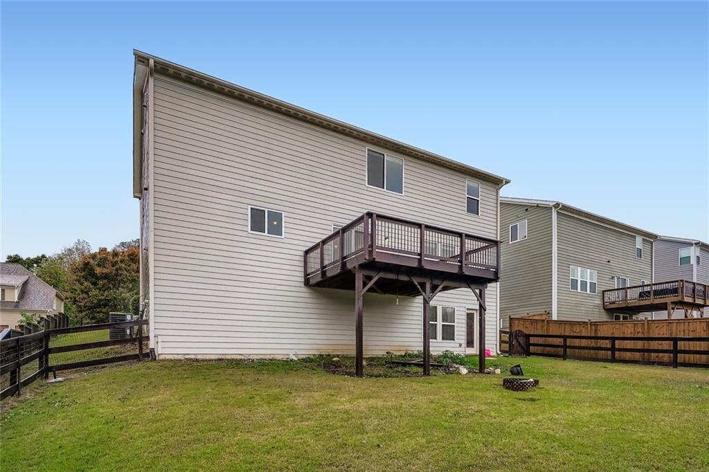 114 Greenbrier Way Canton, GA 30114 - Photo 23 of 32 a view of a house with a yard and a large tree