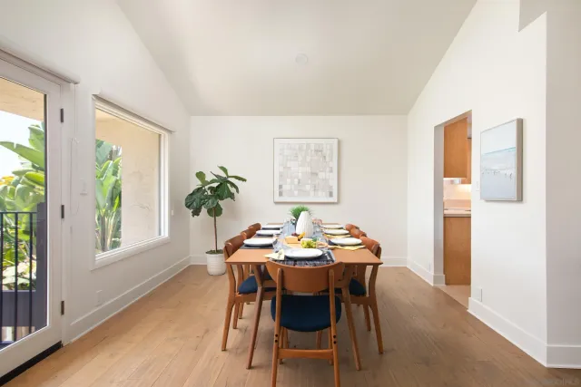 a dining room with furniture and window