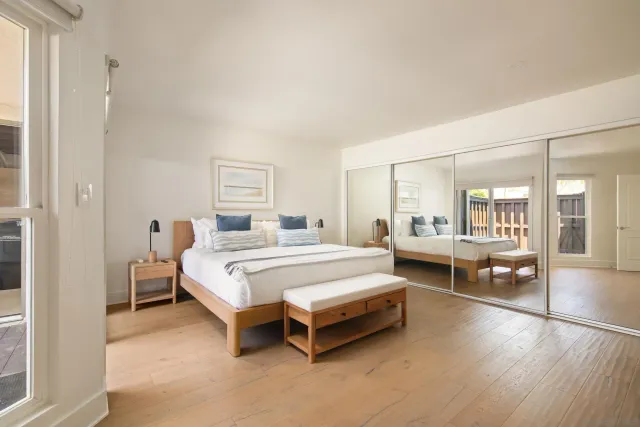 a bed room with a bed and a table