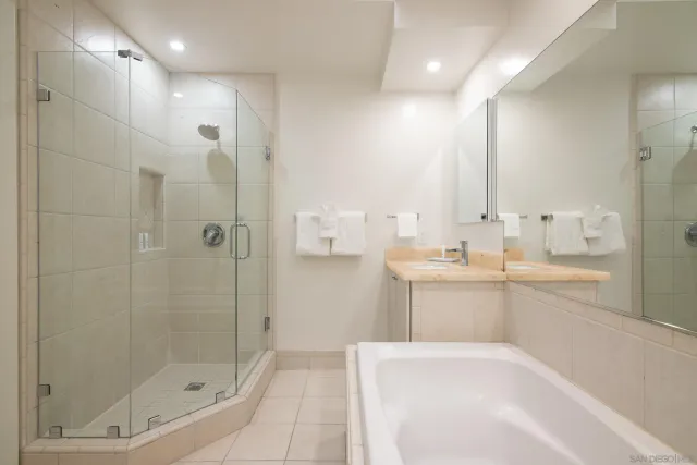 a bathroom with a bathtub and a sink