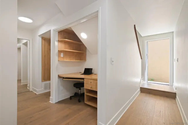 a view of room with a flat tv screen and a window