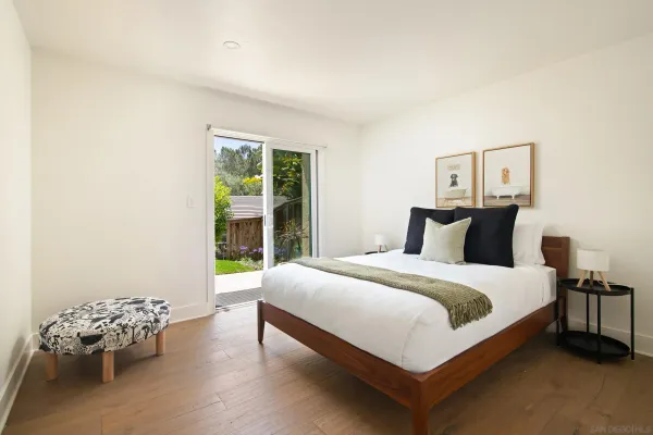 a bedroom with a bed and window