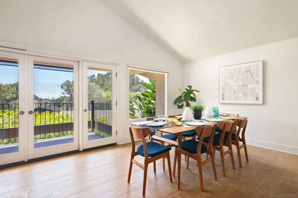 a view of a dining room with furniture window and wooden floor