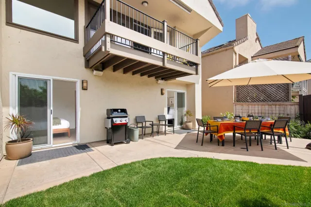 a group of people sitting in front of a building