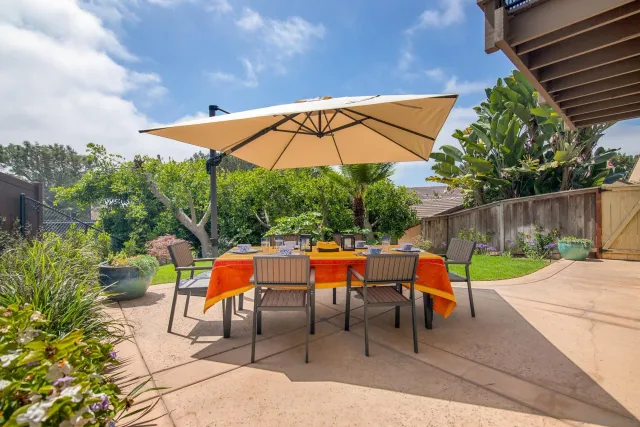 an outdoor space with furniture and umbrella