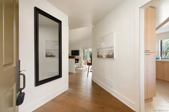 a view of a living room with a wooden floor