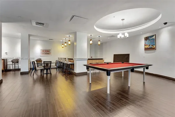 a room with furniture and wooden floor