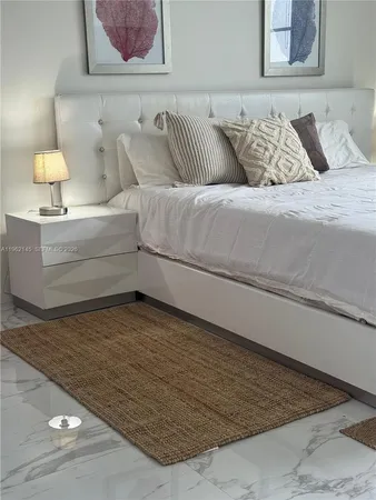 a living room with a couch and a lamp