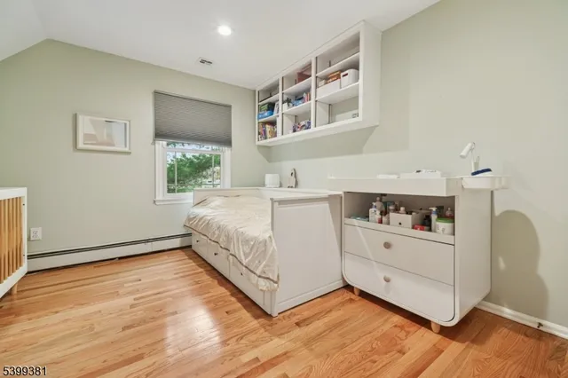 a view of a house with backyard sitting area and garden