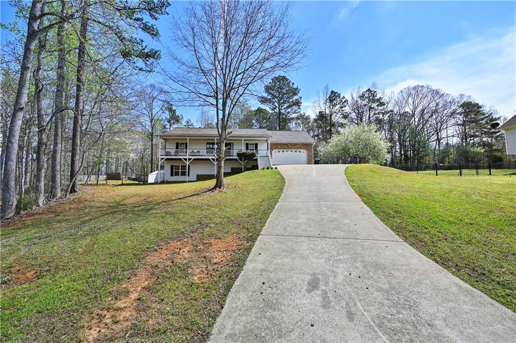 125 Tricias Way Temple, GA 30179 - Photo 2 of 39 a view of a house with a yard