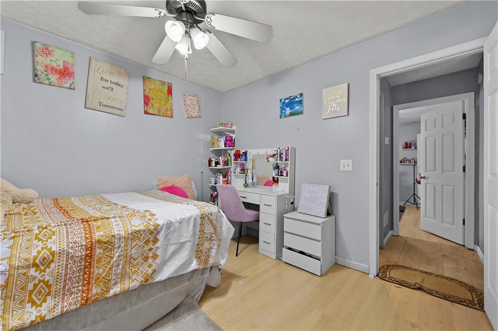 125 Tricias Way Temple, GA 30179 - Photo 25 of 39 a bedroom with a bed and a chandelier