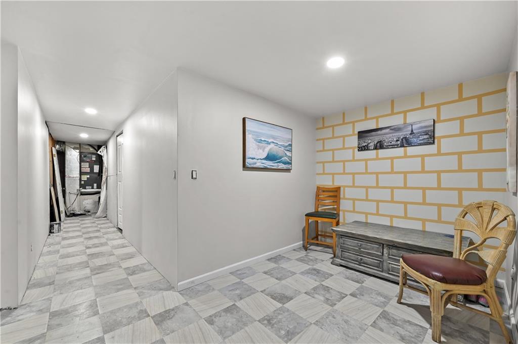 125 Tricias Way Temple, GA 30179 - Photo 26 of 39 a hallway with a chair and white walls