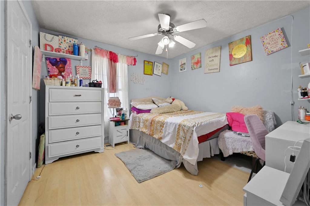 125 Tricias Way Temple, GA 30179 - Photo 27 of 39 a bedroom with a bed and a chandelier