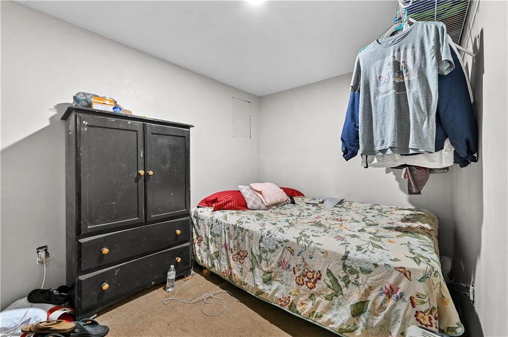 125 Tricias Way Temple, GA 30179 - Photo 31 of 39 a bedroom with a bed and a bathroom