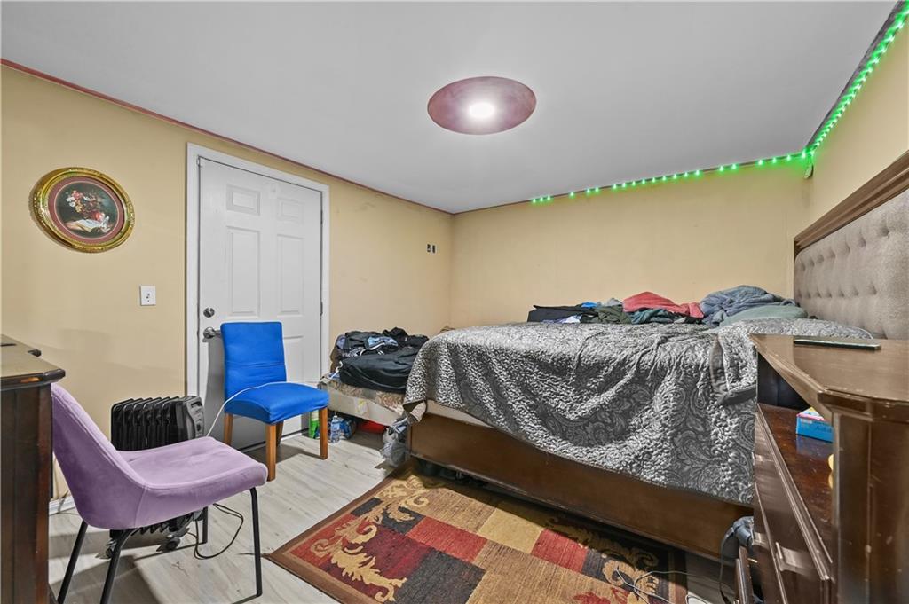 125 Tricias Way Temple, GA 30179 - Photo 32 of 39 a bedroom with a bed and a chair