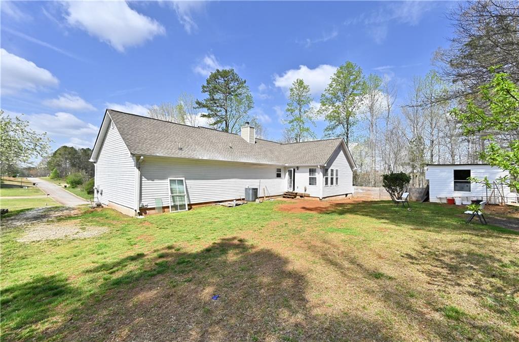 125 Tricias Way Temple, GA 30179 - Photo 37 of 39 a house with garden in front of it