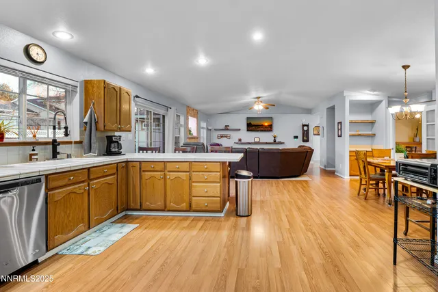 a large kitchen with a table and chairs in it