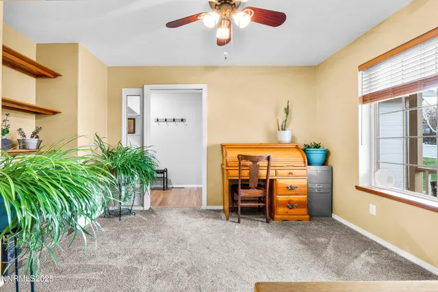 a view of room with furniture and a window