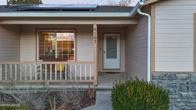 a view of a house with a small yard
