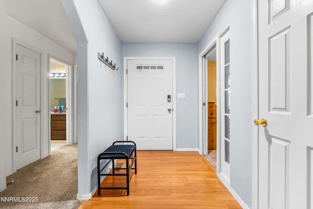 a view of a livingroom with furniture and entryway