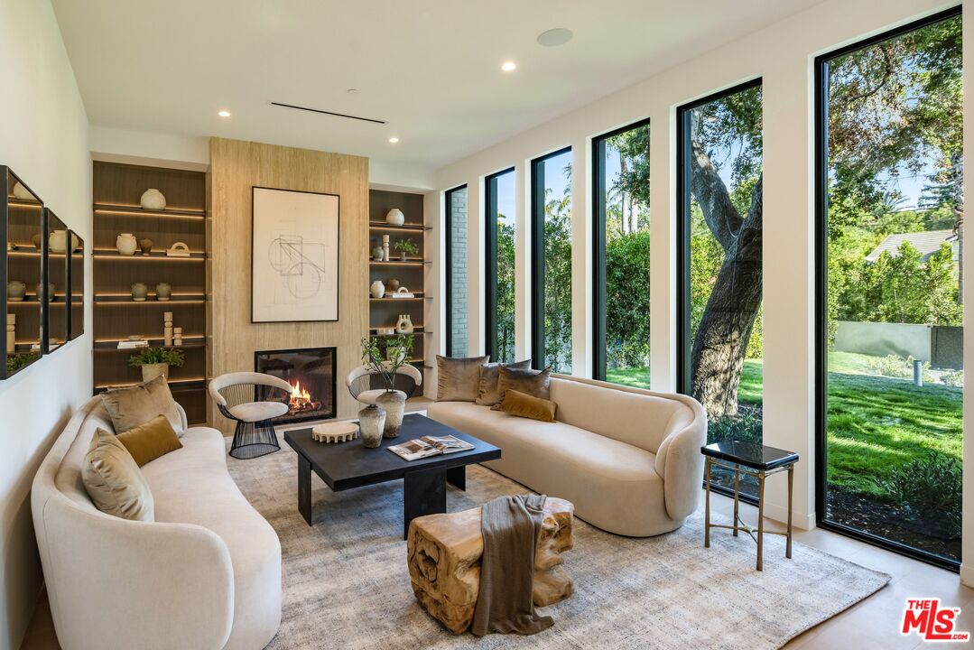 17055 Rancho Street Encino, CA 91316 - Photo 20 of 73 a living room with furniture and a large window
