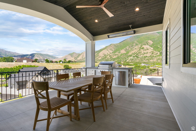 115 East Hidden Ridge Lane, Unit 42 Mapleton, UT 84664 - Photo 81 of 103 Covered patio with a dark wood-finish ceiling, mounted heater, and ceiling fan
