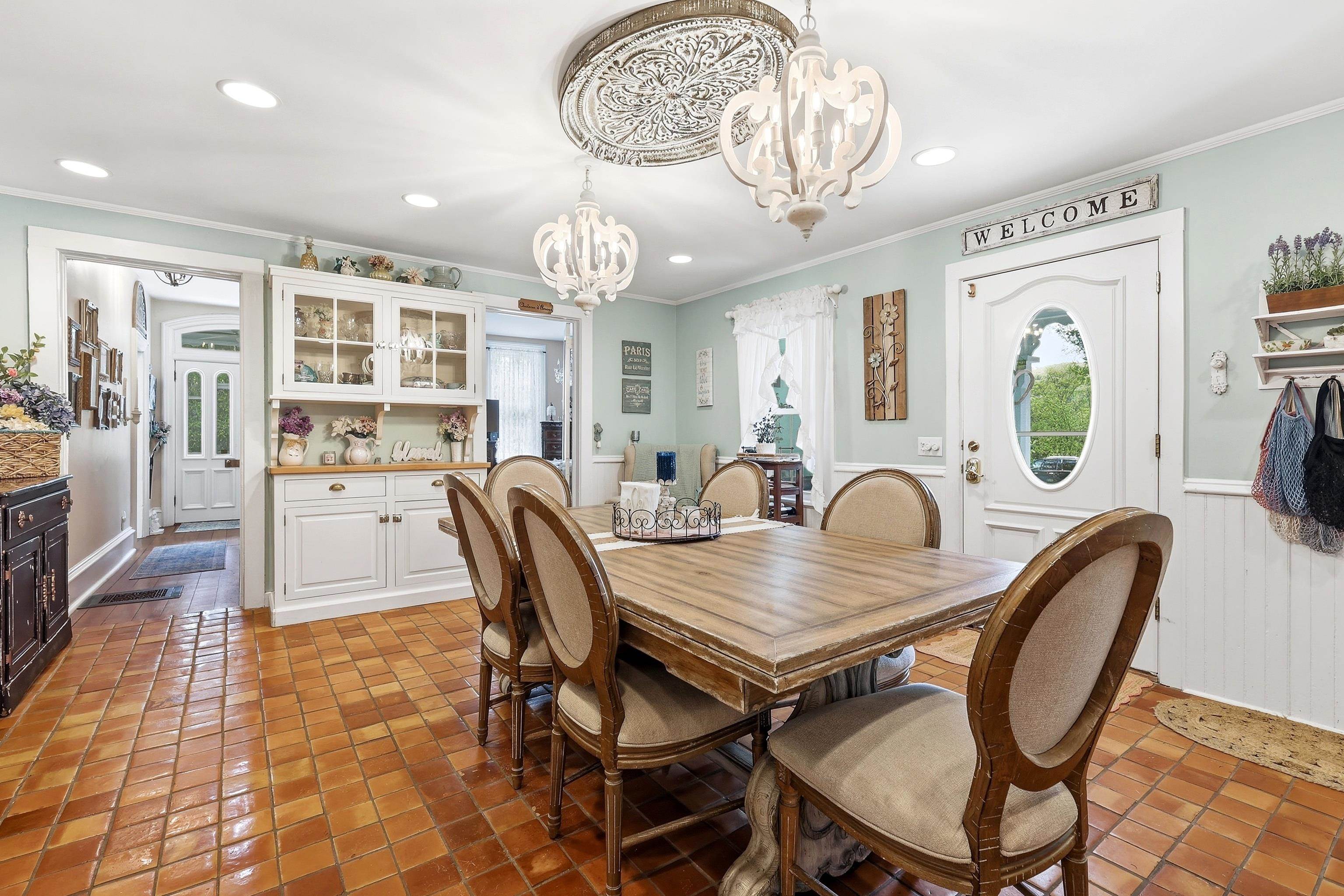 2562 West Blackjack Road Galena, IL 61036 - Photo 24 of 75 a view of a dining room with furniture a chandelier and wooden floor
