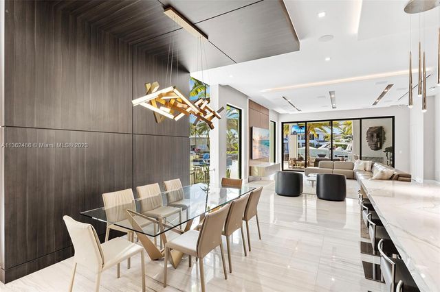 aerial view of a house with a garden and lake view