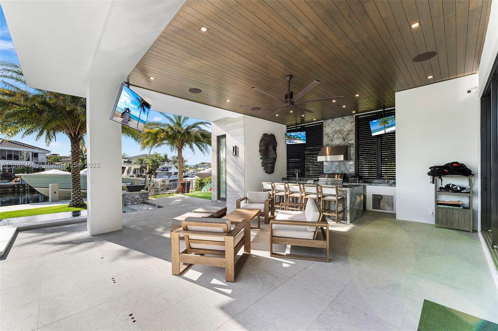 3101 Northeast 27th Avenue Lighthouse Point, FL 33064 - Photo 23 of 78 a building outdoor space with patio furniture and potted plants