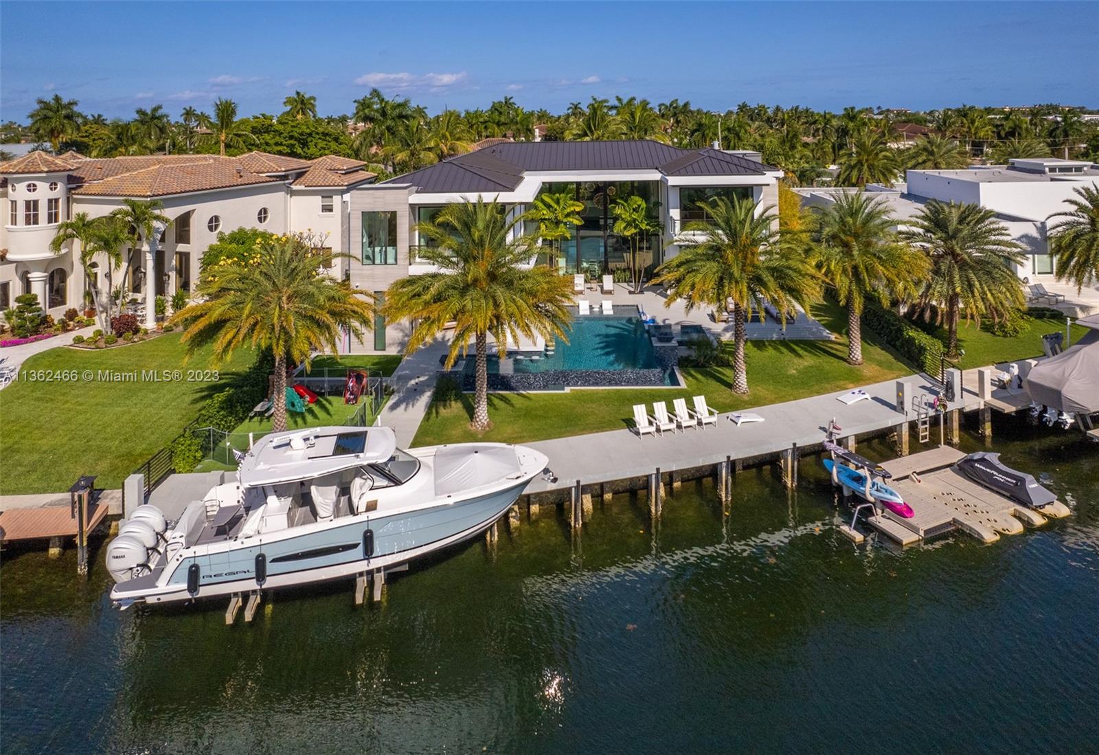 3101 Northeast 27th Avenue Lighthouse Point, FL 33064 - Photo 29 of 78 aerial view of a house with a garden and lake view