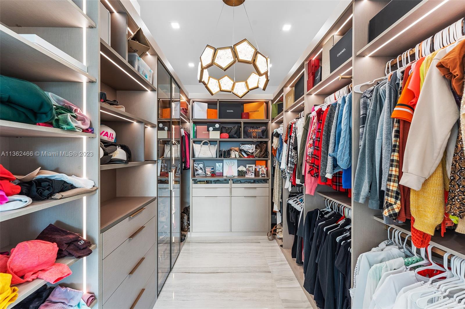 3101 Northeast 27th Avenue Lighthouse Point, FL 33064 - Photo 39 of 78 a view of walk in closet with clothes and shoes