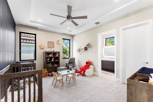 an aerial view of residential building and ocean
