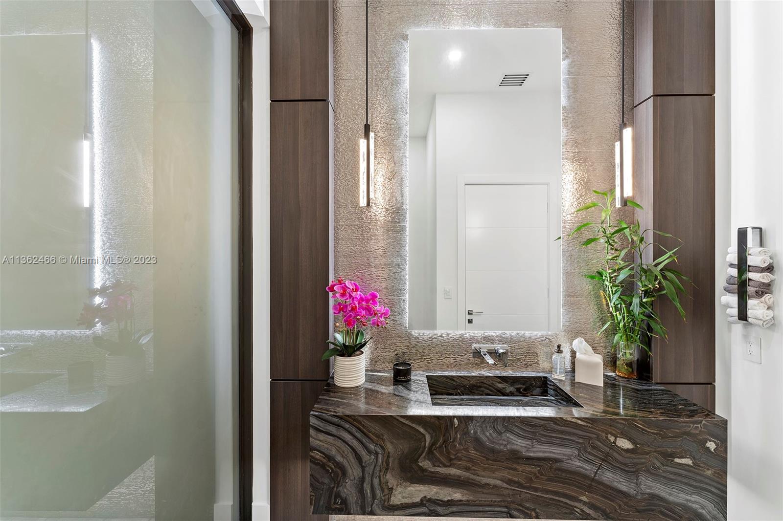 3101 Northeast 27th Avenue Lighthouse Point, FL 33064 - Photo 58 of 78 a bathroom with a granite countertop sink a potted plant and a shower