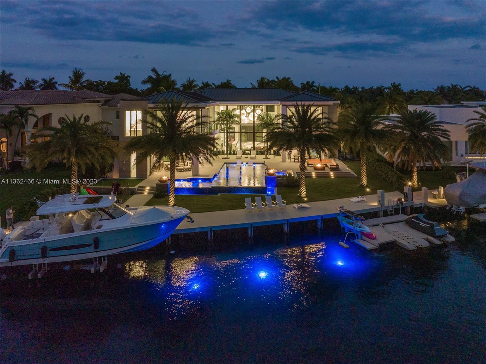 3101 Northeast 27th Avenue Lighthouse Point, FL 33064 - Photo 67 of 78 a view of a swimming pool with an outdoor seating a kitchen