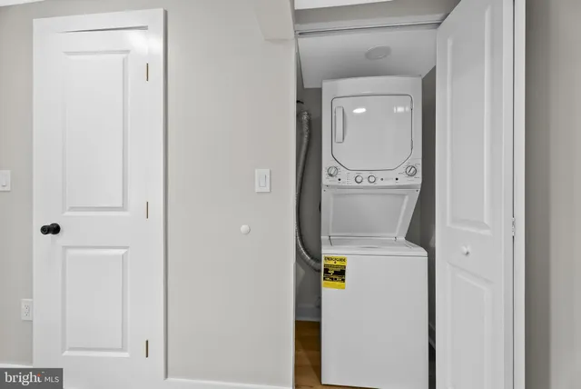 a close view of a utility room with dryer and washer