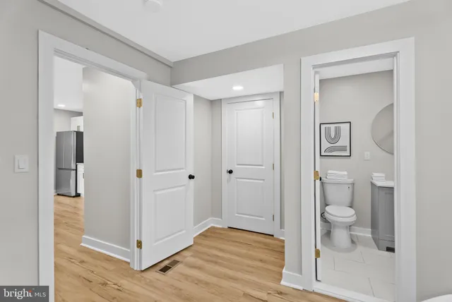 a bathroom with a shower and a toilet