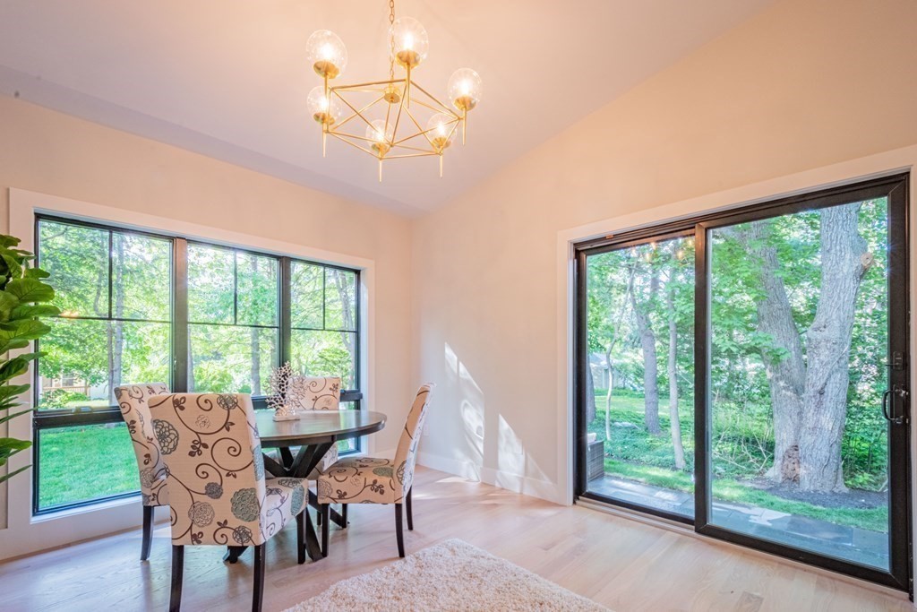 5 Kimball Road Lexington, MA 02421 - Photo 17 of 42 a dining room with furniture large windows and wooden floor