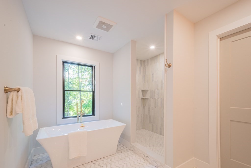5 Kimball Road Lexington, MA 02421 - Photo 26 of 42 a bathroom with a bathtub and shower