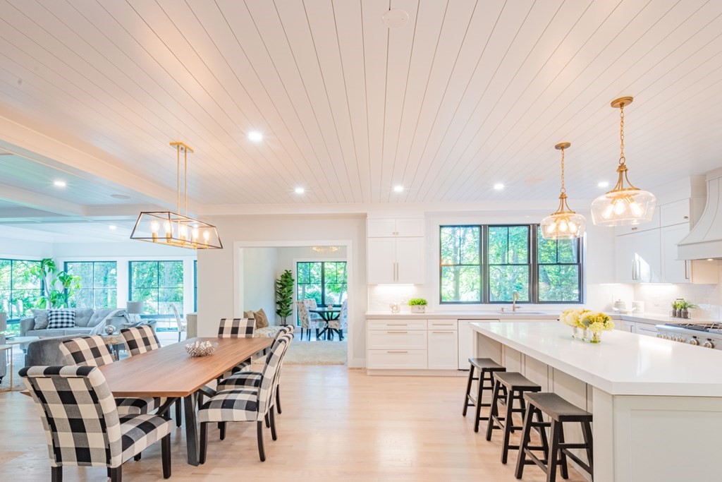 5 Kimball Road Lexington, MA 02421 - Photo 3 of 42 a kitchen with a dining table chairs and large windows