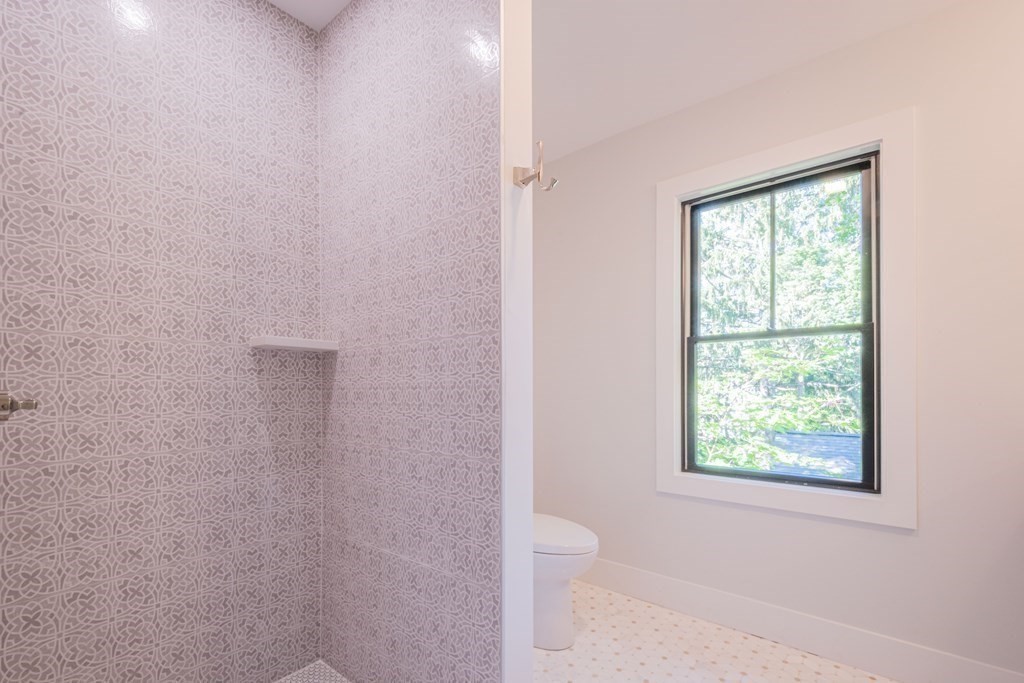 5 Kimball Road Lexington, MA 02421 - Photo 32 of 42 a bathroom with a toilet sink and window