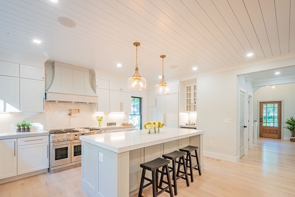 5 Kimball Road Lexington, MA 02421 - Photo 5 of 42 a kitchen with a table and chairs in it