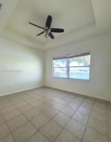 a bathroom with a tub sink shower and mirror