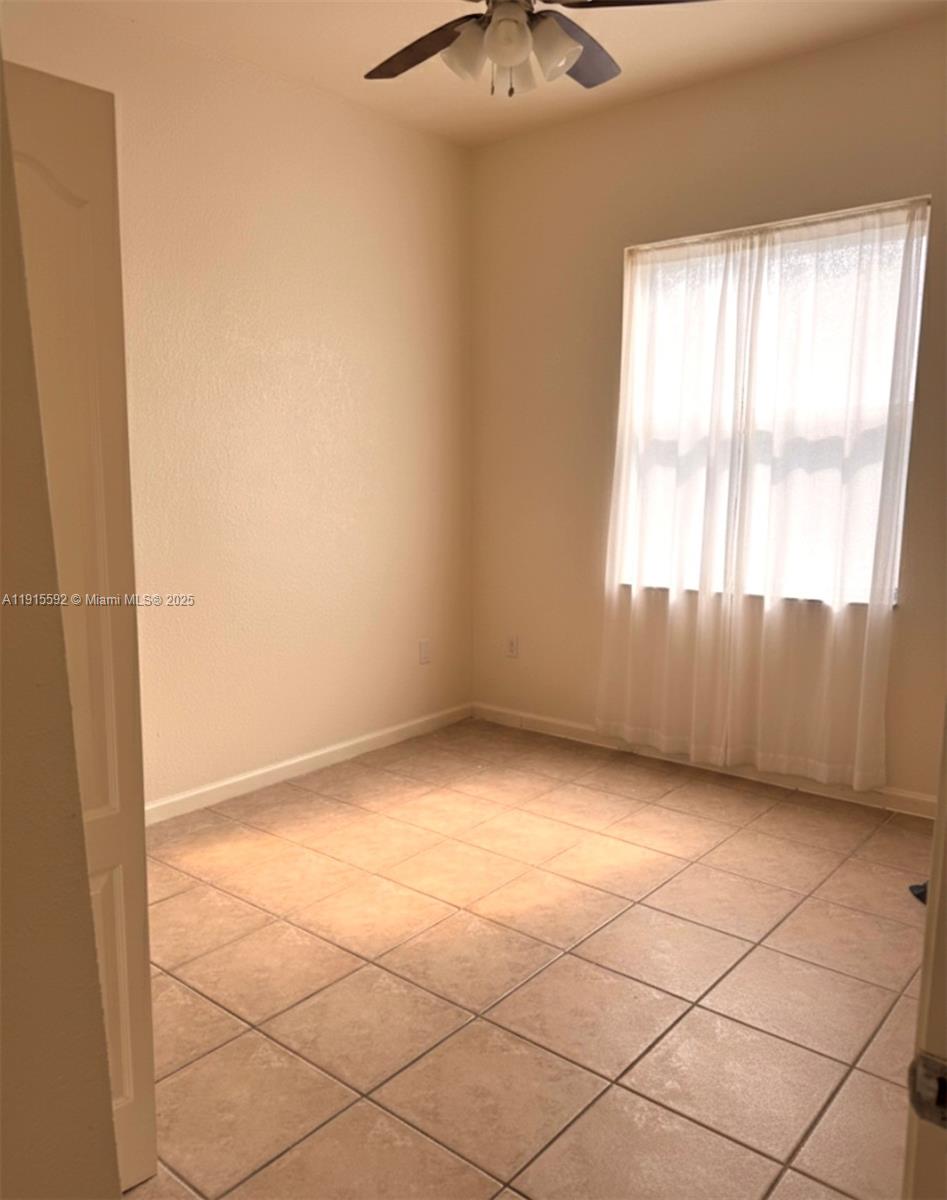 3725 Northeast 23rd Court Homestead, FL 33033 - Photo 20 of 25 a view of an empty room and a window
