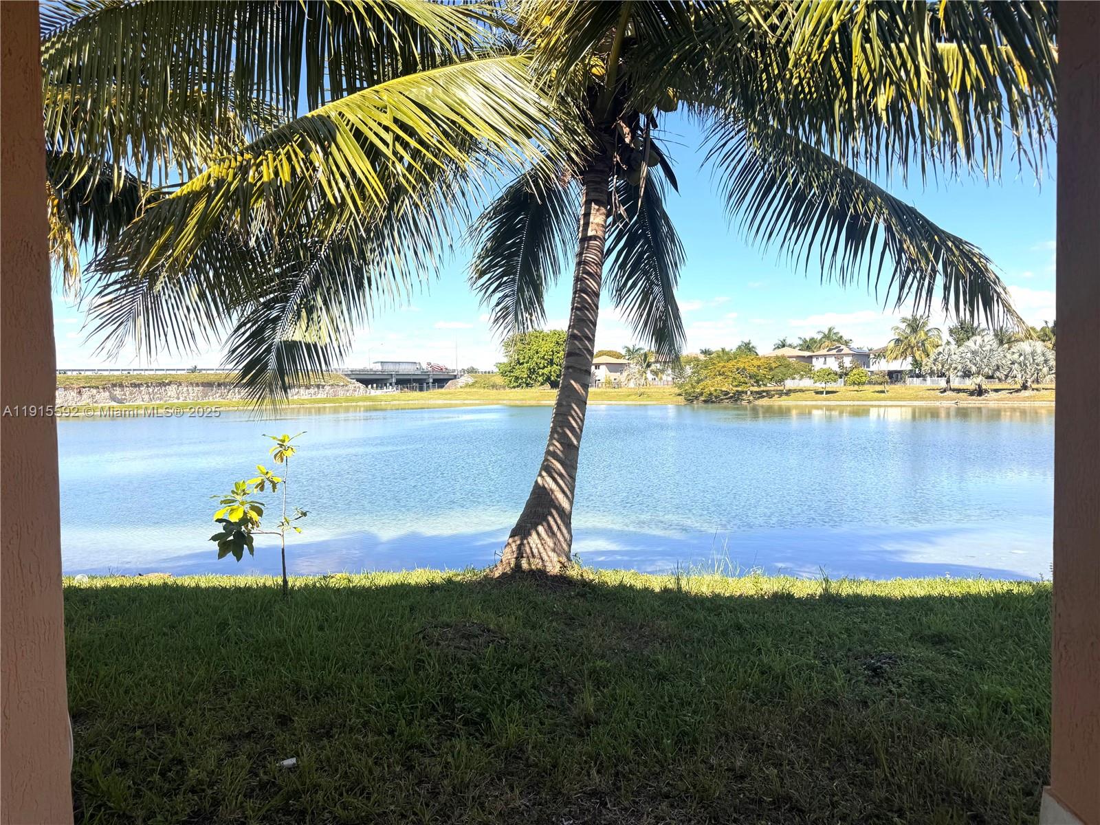 3725 Northeast 23rd Court Homestead, FL 33033 - Photo 24 of 25 a view of a palm and lake