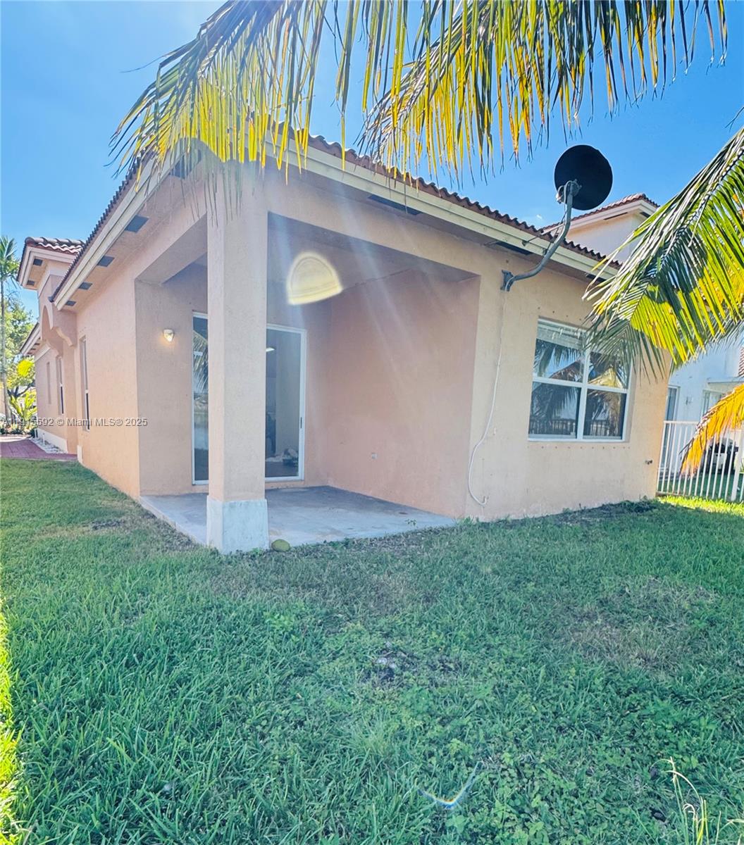3725 Northeast 23rd Court Homestead, FL 33033 - Photo 25 of 25 a front view of a house with garden